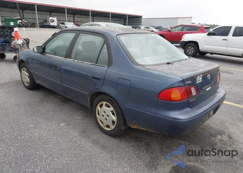 2000 Toyota Corolla Le z USA, uszkodzony, nr VIN 2T1BR12EXYC297082